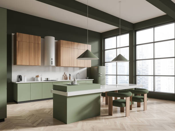 Green home kitchen interior with bar island and chairs, side view. Stylish cabinet with kitchenware and refrigerator, panoramic window on skyscrapers. 3D rendering